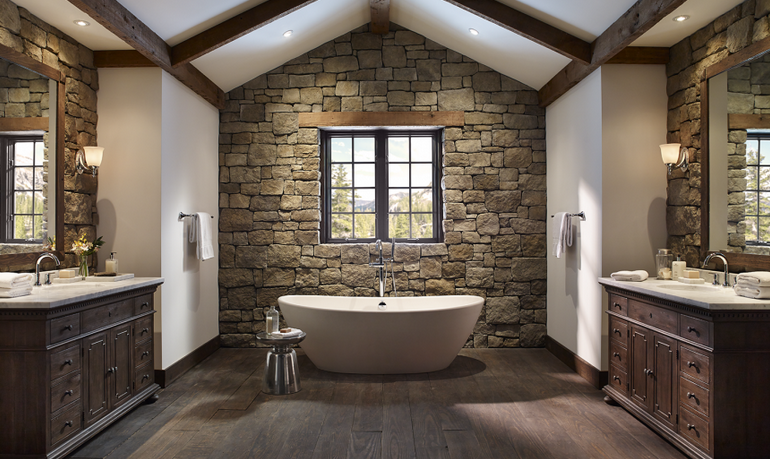 Spacious bathroom with El Dorado stone vaneer and detached tub